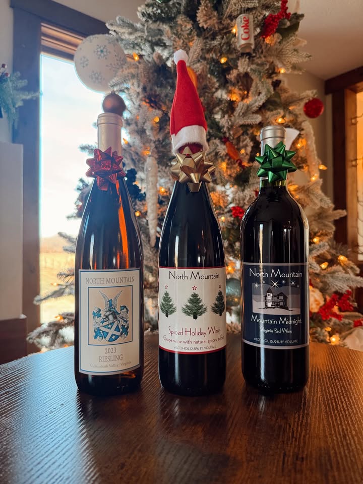 🎄 Day 9 of our 12 Days of Christmas 🎄 Looking for an easy, elegant gift? We’ve got you covered. 🍷 $5 OFF our pre-made 3-bottle gift sets, beautifully packaged and ready to gift. No wrapping, no stress, just great wine. ✨ Perfect for: • Host gifts • Holiday parties • Last-minute shopping • Treating yourself (we won’t judge 😉) **Present bows on gift boxes while supplies last!** 📍 Available in the tasting room ⚠️ Cannot be combined with other offers Stop by North Mountain Vineyard & Winery and check one off your list today! 🍇🎁 #12DaysofChristmas #Day9 #NorthMountainVineyardAndWinery #WineGifts #HolidayWine #ReadyToGift #VirginiaWine #ShopLocalVA #ChristmasWine #WineLovers #ShenandoahValley